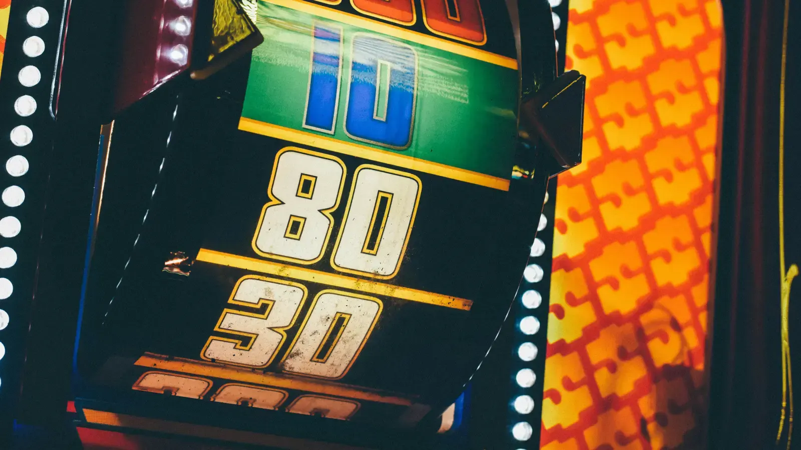 Close crop of a slot cabinet paytable showing the numbers eighty and thirty
