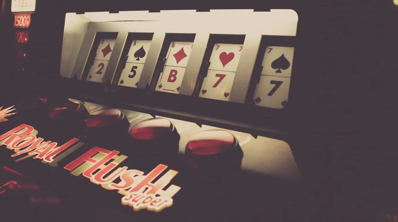 Rendered row of five playing cards above a Royal Flush logo